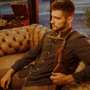 Model seated wearing the Lashasana brown vegan cactus leather holster