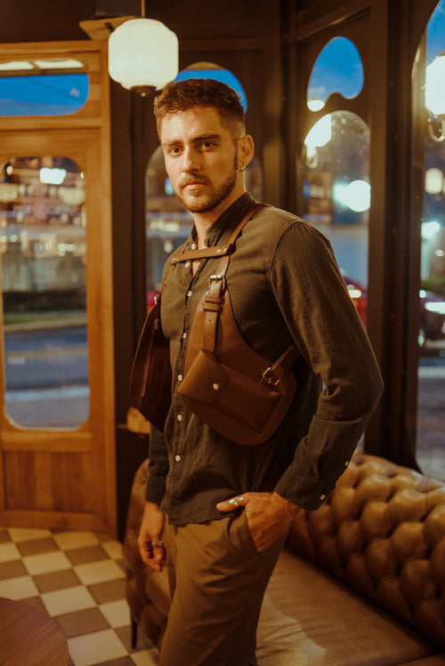 Model standing wearing the Lashasana brown vegan cactus leather holster, alternate pose