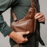 Model wearing the Lashasana brown vegan cactus leather holster against a plain background