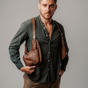Model holding the Lashasana brown vegan cactus leather holster