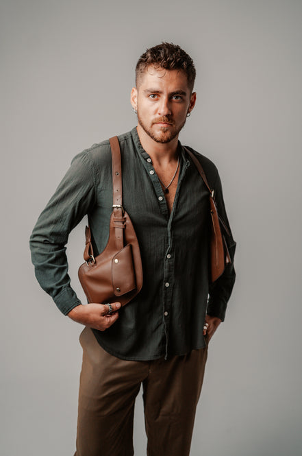 Model holding the Lashasana brown vegan cactus leather holster
