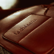 Detail of hand-finished stitching on the Lashasana vegan cactus leather holster